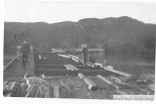 Building the Little Merasheen wharf around 1965.&amp;nbsp; It's cost: $57,000. Mike Ennis is on the left with his dog Ringo.&amp;nbsp; Across the harbour, Ron Pitcher's punt is moored to the breakwater.