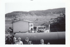On the government wharf in 1965.&amp;nbsp; By the freight shed are Paddy Hann, Tommy Pittman and Harold Rose.&amp;nbsp; Father Power's jeep.&amp;nbsp; To the left of the fuel tank for the new power house is Andy Ennis and Betty Ennis.