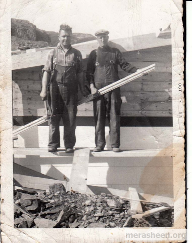 Johnny Wilson and Amelius Best building the fish plant around 1955